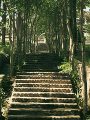 Kediri, East Java, Indonesia - February, 09 2024: Long Stairs in the Cave of Virgin Mary Puhsarang