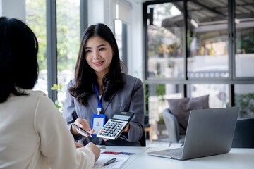 Employees present mock up credit card payments to business customers. Ready to provide discounts and life insurance