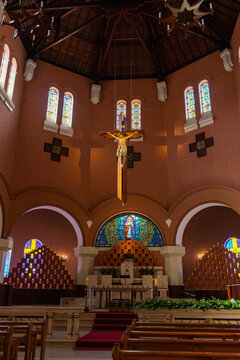 Altar da Bas&iacute;lica Nossa Senhora da Saude - PO&Ccedil;OS DE CALDAS, MG, BRAZIL - JULY 21, 2023: Altar of the Basilica Our Lady of Health with the image of Jesus Christ crucified and beautiful stained glass.