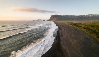 white waves on a black sand beach in a volcanic island in iceland from a drone view