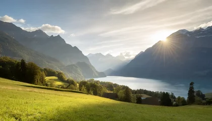 Photo sur Plexiglas Alpes idyllic swiss nature landscape green meadows surrounded by alps mountains scenic lake brienz iseltwald village