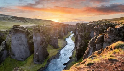 Zelfklevend Fotobehang beautiful mystical landscape with river in canyon kolugljufur between the rocks in iceland at red dawn exotic countries amazing places © Kristopher