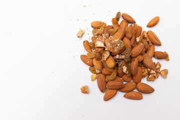 Scattered almonds on white background
