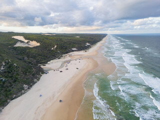 Aerial views of 75 Mile Beach highway on the sand island of K’gari, Queensland, Australia