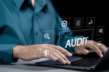 Audit business concept. Businessman using laptop to audit and evaluate corporate financial...