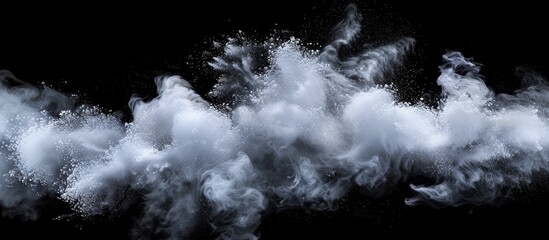 White powder cloud on black background