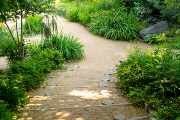 Japanese garden. A garden path with steps.