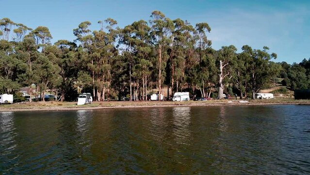 Camper Vans And Motorhomes Parked On The Shore In Bruny Island, Tasmania, Australia - Aerial Sideways