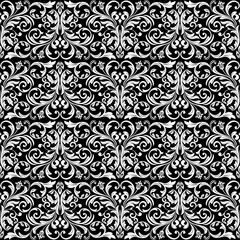 Floral pattern. Vintage wallpaper in the Baroque style. Seamless vector background. White and black ornament for fabric, wallpaper, packaging. Ornate Damask flower ornament.
