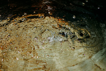Water splashes in the koi fish pond