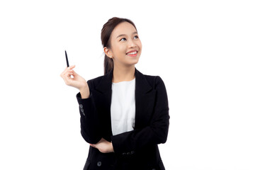 A cheerful young asian businesswoman in a suit, smiling and looking up, holding a pen, celebrating...
