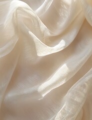ivory-colored tulle fabric with subtle folds and waves creating intricate patterns. Texture of gauze bandage, organza or linen as background banner.