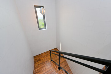 Brightly colored wooden colored stairs made from maple wood, which is always in trend