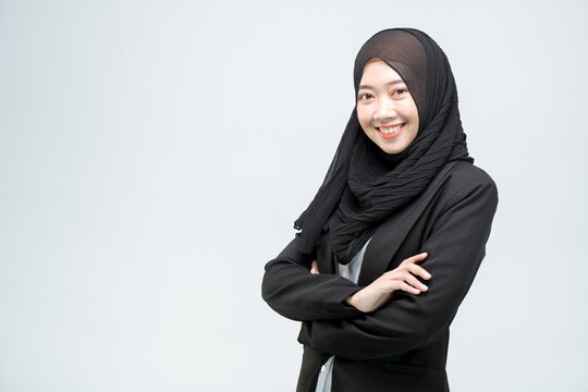 Business woman, Business, An office worker for an Asian Muslim woman stands with arms crossed with a happy face and a commitment to work, on white background.