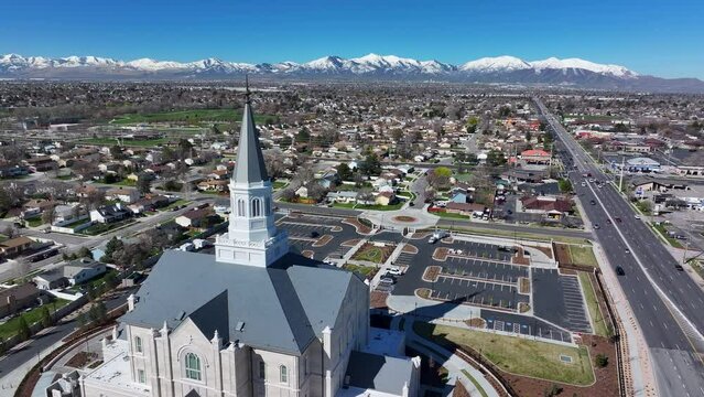 Aerial Taylorsville Utah LDS temple spire forward 2. The Church of Jesus Christ of Latter-day Saints, LDS or Mormon religion. Fast growing Christian religious sect. Sacred eternal worship.