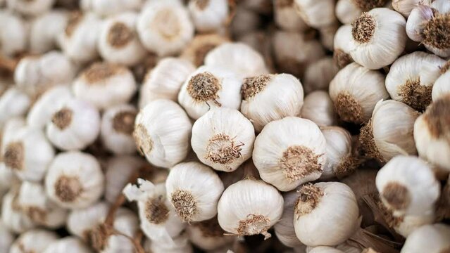 a lot of garlic in the local market, vegetarian life, healthy diet, view from the above , food market,