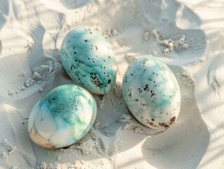 Obraz na płótnie Canvas Oceanic Easter eggs brushed with seafoam greens and blues