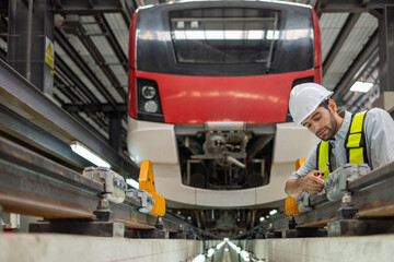 Electric train technician engineer checking controls system for security functions in maintenance...