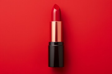 Red lipstick on a red background, flat lay. Top view 