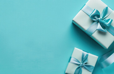 Top view romantic gift box adorned with ribbon on blue background, Present for special occasions.