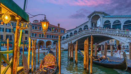 Panoramic view of famous Canal Grande with famous Rialto Bridge at sunset, Venice - 775567983
