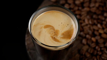 Hot black espresso coffee in glass, close up