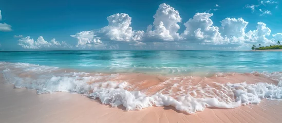 Fotobehang Beautiful white sand beach and calm waves of the turquoise ocean on a sunny day on the background of white clouds in the blue sky. Beautiful colors. Natural landscape. © PT