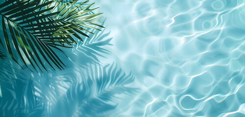 Tropical summer background with clear blue water and reflective shadows of palm trees. Top view of blue water.