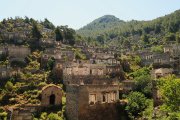 Remains of houses on a hill in the abandoned village of Kayaköy, Livissi, close to Fethiye, Turkey
