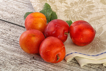 Red juicy raw plum heap