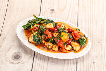 Chicken with tomato and spinach