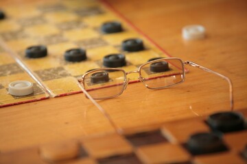 A board with checkers on the table