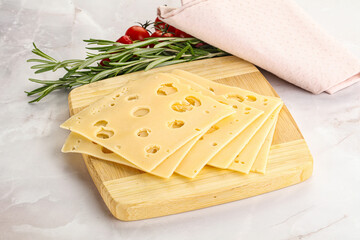 Sliced maasdam cheese with holes