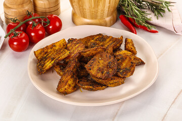 Golden baked potato Idaho with spices