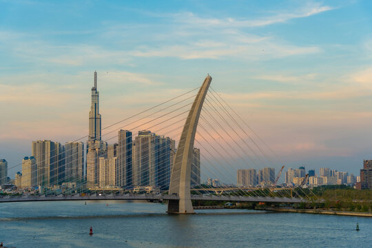 Ho Chi Minh City, Vietnam - Mar 27, 2023: Aerial sunset of Bach Dang Port and Saigon River in Ho Chi Minh City, Vietnam with Ba Son Bridge and Landmark 81 skyscraper in the far side