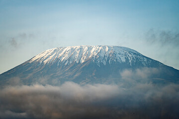 peak of the snow-covered Kilimanjaro volcano. Snow on top of Mount Kilimanjaro in Amboseli