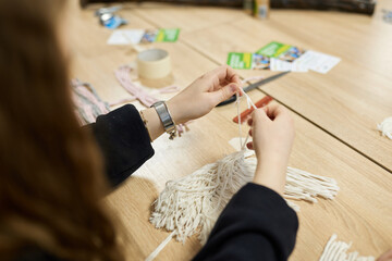 The process of making decor from threads with your own hands.