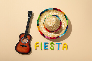 The inscription fiesta with a sombrero on a light background