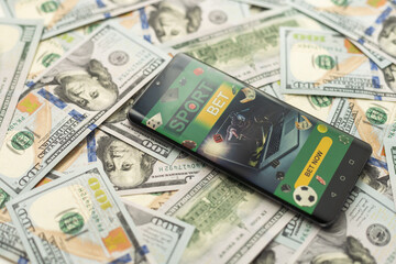Smartphone with gambling mobile application with money close-up. Sport and betting concept
