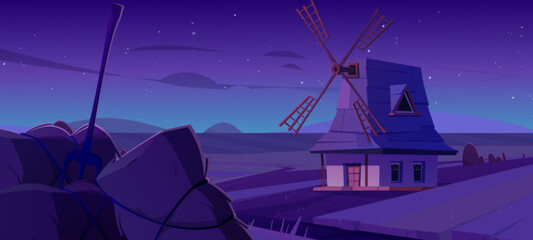 Obraz premium Old windmill in night summer field. Vector cartoon illustration of rural scenery with wheat farmland, blades on roof of house, haystack with pitchfork, stars glowing in dark sky, farming game backdrop