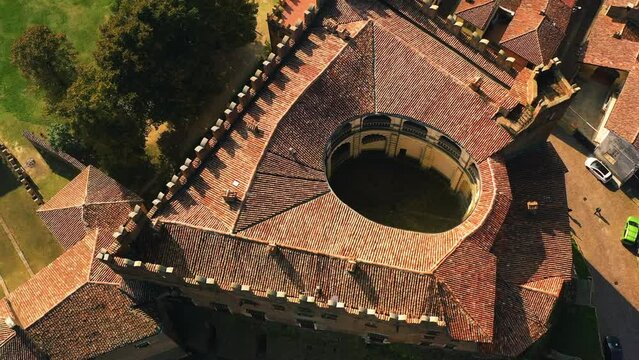 Drone rising around the Montemagno Castle, sunny evening in Monferrato, Italy