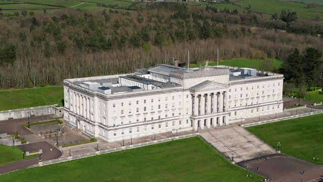 Wide shot of Stormont, Belfast Parliament Buildings from above on a sunny day.

Camera pans left to right, revealing showing Parliament Buildings.

Filmed in 4K at 30fps with Rec709 color space.