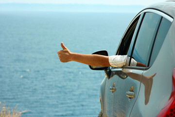 A happy guy in auto sea background