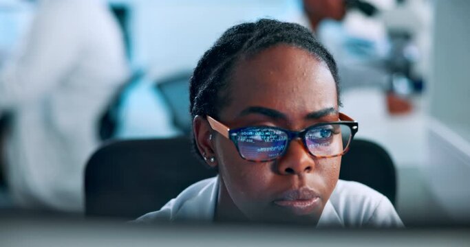 Science, research and woman at computer reading results in pharmaceutical study in laboratory. Glasses, thinking or African scientist checking website with medical innovation, technology or lab ideas