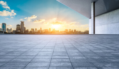 Empty square floor and wall with city skyline at sunset in Shanghai. panoramic view.