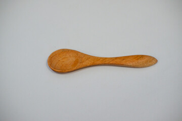 wooden spoon on white background