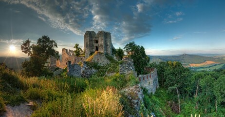 The old fortified castle, a historical ruin of a medieval castle. Ruin of castle Gymes at sunset,...