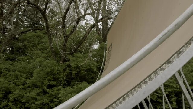 In Lawrence, KS, a skater savors the thrill of the Corey Lawrence halfpipe, also referred to as the vert ramp. The art of skating as it embodies leisure and free time, slow-motion enchantment.