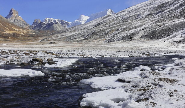 scenic alpine valley and surrounding snowcapped himalaya mountains at zero point, a popular tourist destination in north sikkim in india