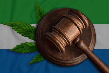Judges gavel and cannabis leaf on the flag of Sierra Leone